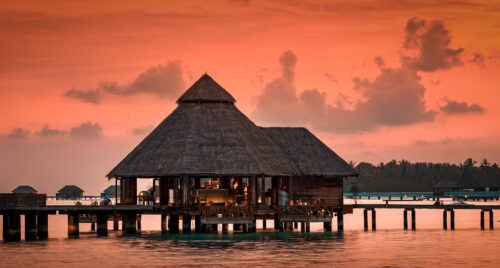 Conrad Maldives Rangali Island Sunset Grill overwater dining at dusk